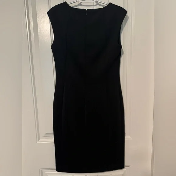 CALVIN KLEIN
Pre-loved Black Dress with Chain Accent💕
Size: 8 - Picture 10 of 10